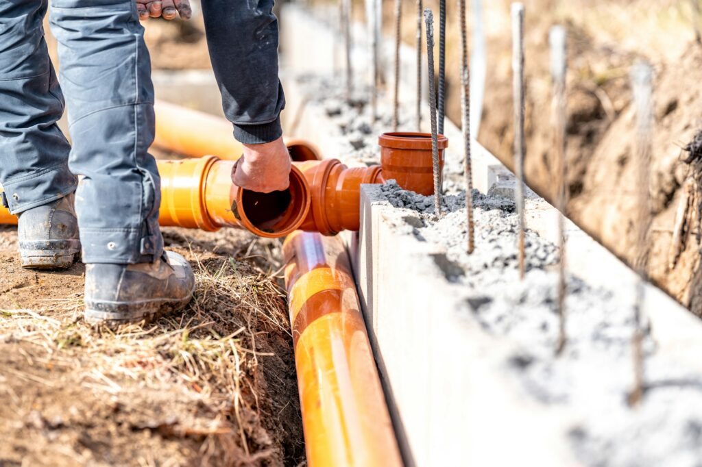 installation of a sewage plastic pipe during the construction of a house